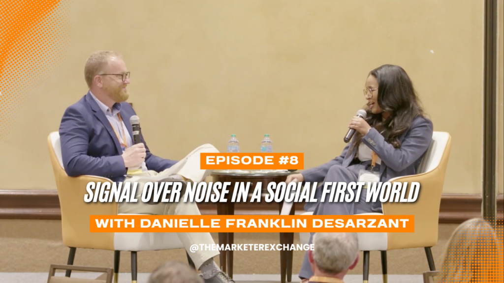 Zach Thompson interviewing Daniel Franklin Desarzant on stage